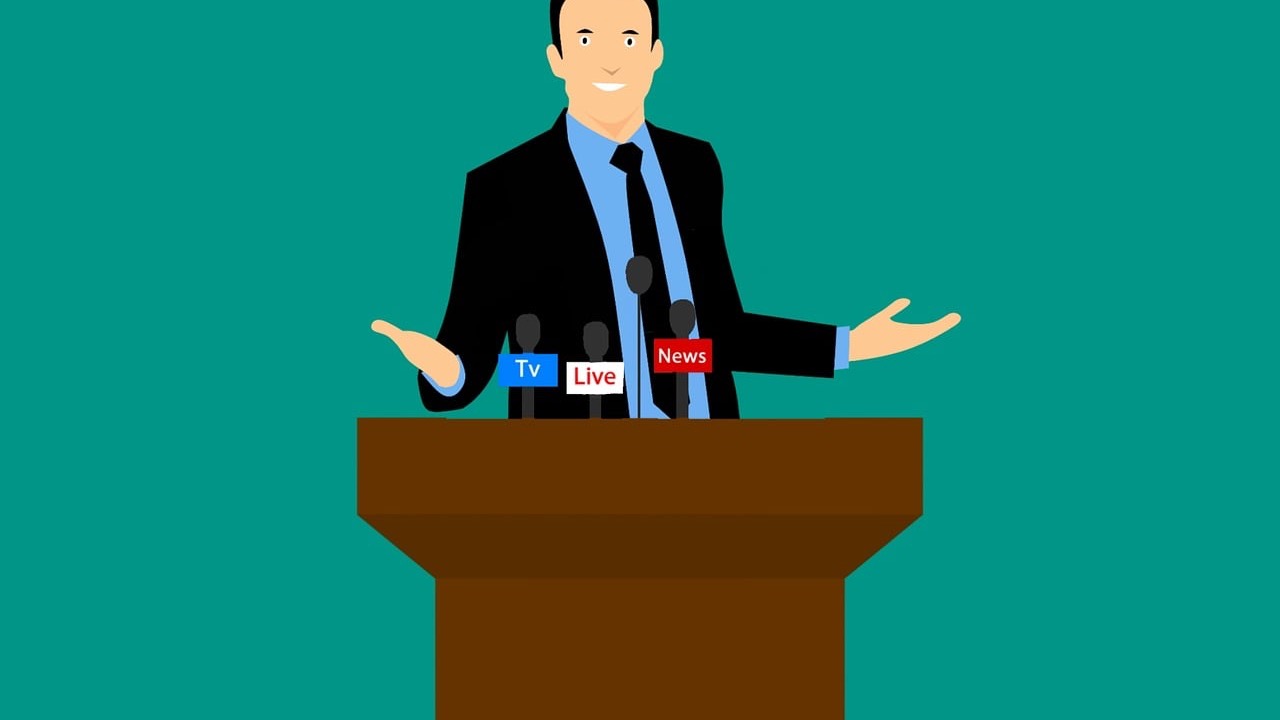 記者会見で話す人物のイラスト